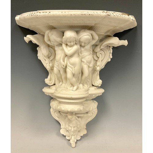 673 - A Victorian Parian wall bracket, classically modelled with three cherubs, birds, fruiting vines and ... 