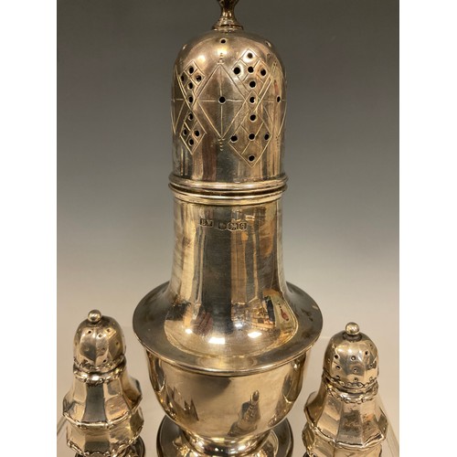 15 - A George III style silver sugar caster, Viners, Sheffield 1933;   two pairs of pepperettes, Birmingh... 