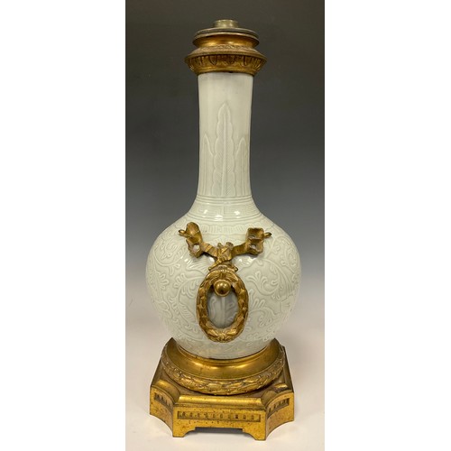 167 - A 19th century Chinese Celadon and Ormolu mounted table lamp base, all over scrolling leaf and vine ... 