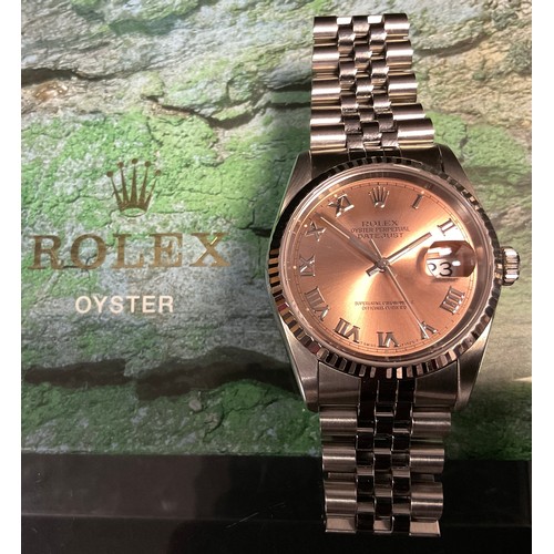 139A - A Rolex Oyster Perpetual Datejust stainless steel wristwatch, salmon dial, the dial 30mm diameter, u... 