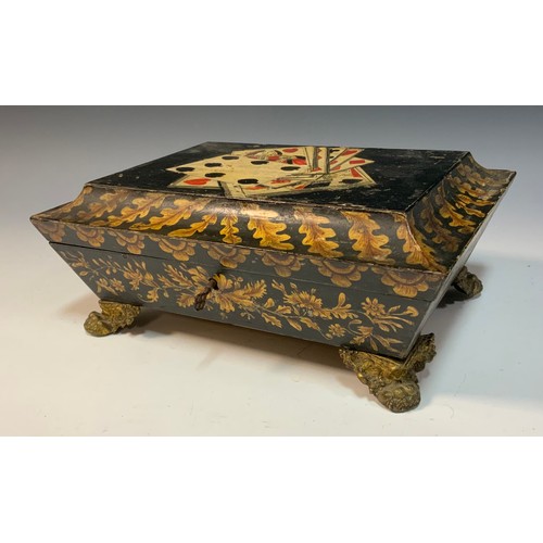 163A - A Regency penwork sarcophagus games box, the hinged cover decorated with playing cards, brass leafy ... 