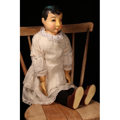 4007 - Folk Art - a large carved wooden shoulder head and partially stuffed cloth bodied doll, probably Ame... 
