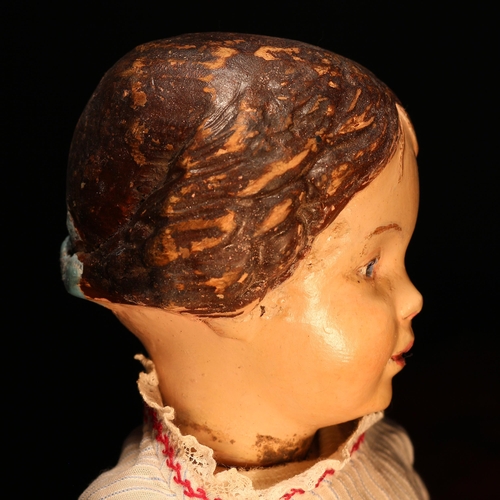 4008 - An early 20th century Schoenhut carved and painted wooden character doll, the carved and painted woo... 