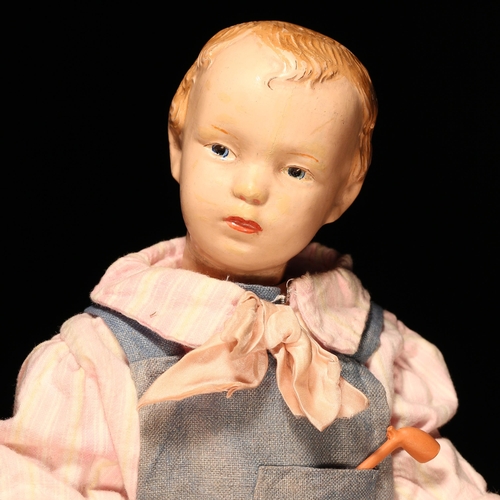 4009 - An early 20th century Schoenhut carved and painted wooden character doll, the carved and painted woo... 