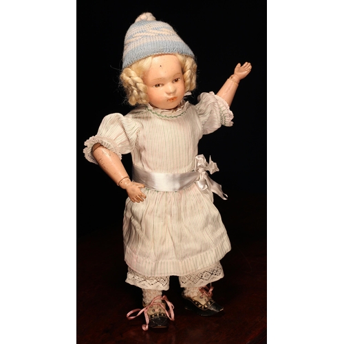 4010 - An early 20th century Schoenhut carved and painted wooden character doll, the carved and painted woo... 
