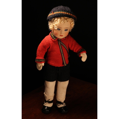 4017 - A 1920's Chad Valley doll, the moulded felt face with painted features and inset blue glass eyes, bl... 