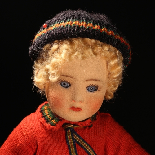 4017 - A 1920's Chad Valley doll, the moulded felt face with painted features and inset blue glass eyes, bl... 