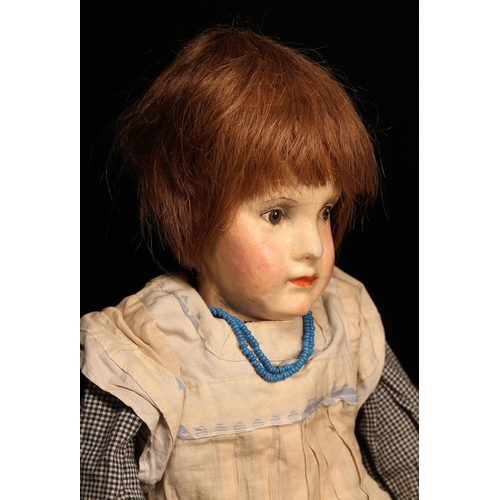 4019 - A 1920's Dr Dora Petzold (Germany) painted composition or papier-mâché head and stuffed cloth bodied... 