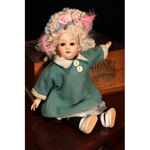 4022 - A Gebrüder Heubach (Germany) bisque head and jointed painted composition bodied doll, the bisque hea... 