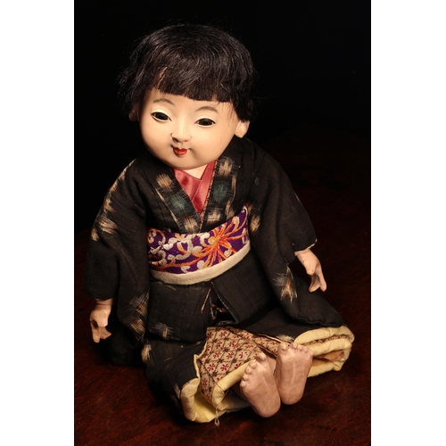 4032 - A Japanese gofun Ichimatsu traditional play doll, the gofun head head with inset fixed eyes and pain... 