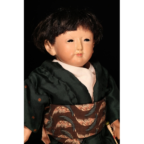 4034 - A Japanese gofun Ichimatsu traditional play doll, the gofun head head with inset fixed eyes and pain... 