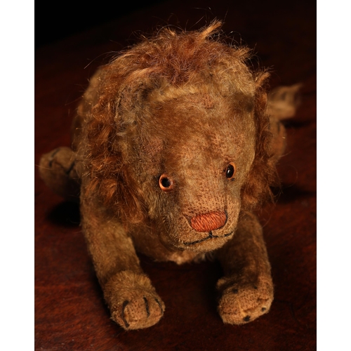 4039 - An early 20th century jointed golden mohair Lion, attributed to Steiff (Germany), amber and black gl... 