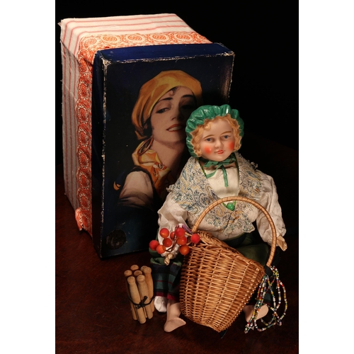 4052 - An English bisque shoulder head doll, modelled as a Gypsy, the bisque head with painted features inc... 