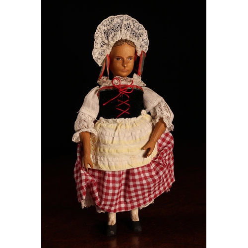 4060 - A Swiss carved wooden doll, probably produced in the Brienz Region, the carved wooden head with pain... 