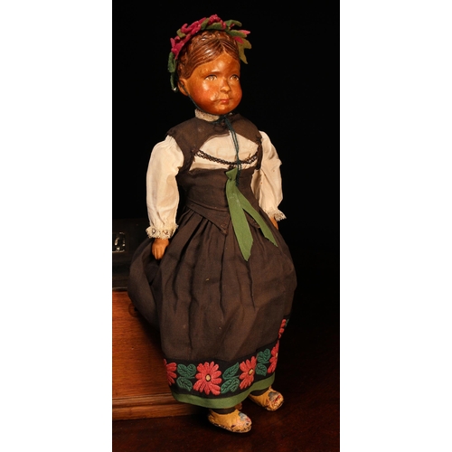 4062 - An early 20th century Swiss carved wooden head doll, probably produced in the Brienz Region by Huggl... 