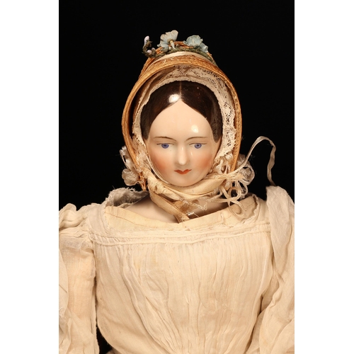 4071 - A 19th century glazed china shoulder head doll, the glazed head with painted features including blac... 