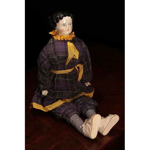 4073 - A 19th century glazed china shoulder head doll, the glazed head with painted features including blac... 