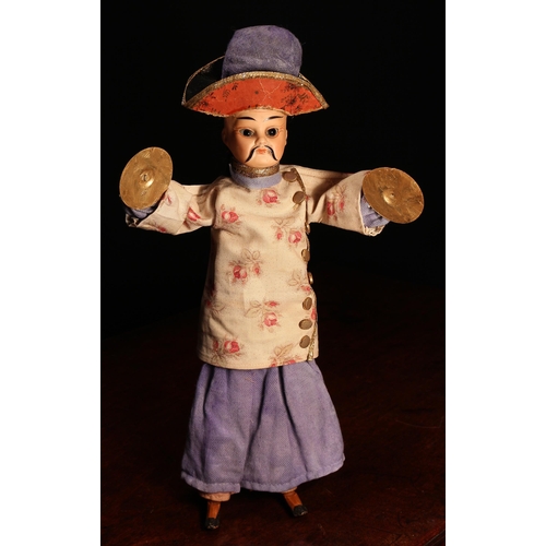 4077 - A bisque head novelty 'automaton' type doll, in the form of a Chinese musician, the bisque head with... 