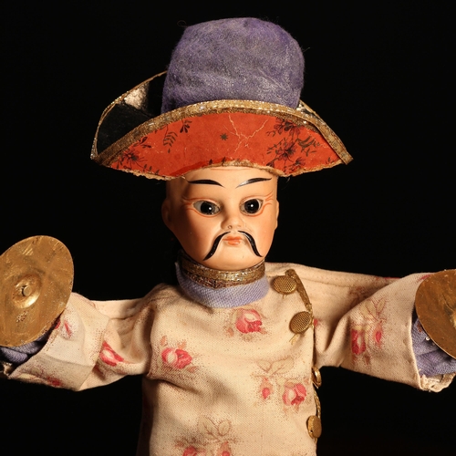 4077 - A bisque head novelty 'automaton' type doll, in the form of a Chinese musician, the bisque head with... 