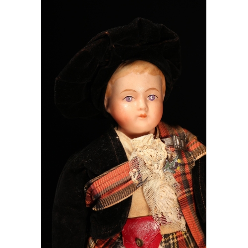 4079 - A bisque shoulder head costume doll, the bisque shoulder head with painted features including brown ... 