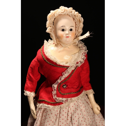 4089 - A 19th century papier-mâché shoulder head doll, the papier-mâché shoulder head inset with fixed brow... 