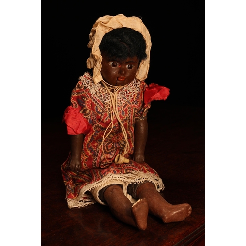 4090 - An early 20th century painted composition black shoulder head 'automaton' type doll, the painted com... 