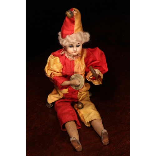 4094 - A Gebruder Knock (Germany) bisque head novelty 'automaton' type doll, in the form of a Jester, the b... 