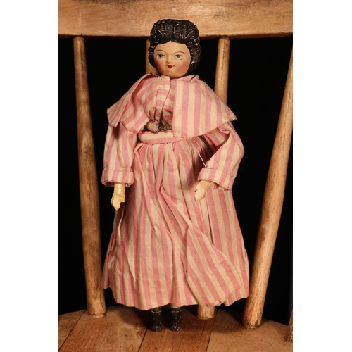 4095 - A 19th century 'Grödnertal' or 'Dutch' peg style doll, the carved and painted head with painted feat... 