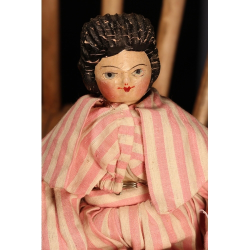 4095 - A 19th century 'Grödnertal' or 'Dutch' peg style doll, the carved and painted head with painted feat... 