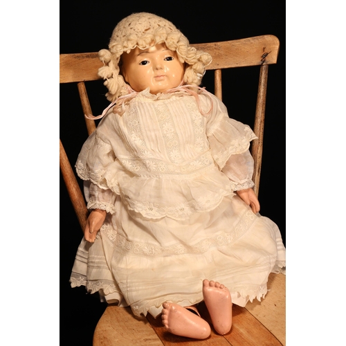 4097 - A 19th century Sonnenberg Taufling doll, the painted composition type head inset with fixed brown gl... 