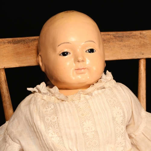 4097 - A 19th century Sonnenberg Taufling doll, the painted composition type head inset with fixed brown gl... 