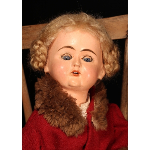 4101 - An early 20th century tout en bois Bébé doll, the wooden head with weighted sleeping blue glass eyes... 