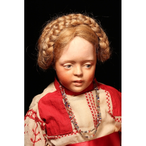 4103 - A bisque shoulder head character doll, the bisque shoulder head with blue side glancing intaglio eye... 