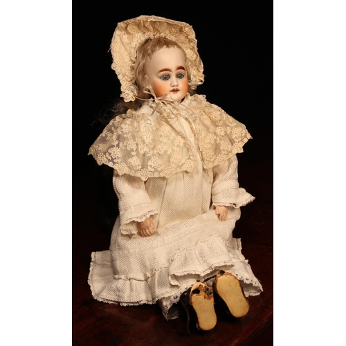 4110 - A bisque shoulder head doll, the bisque shoulder head with weighted sleeping blue glass eyes, painte... 