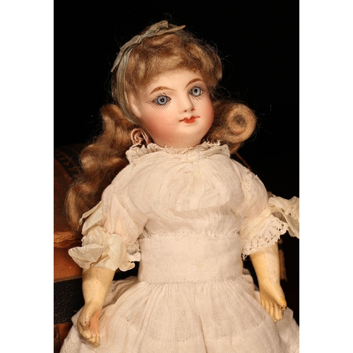 4111 - A late 19th century French bisque head Bébé doll, of small proportions, the bisque head with inset f... 