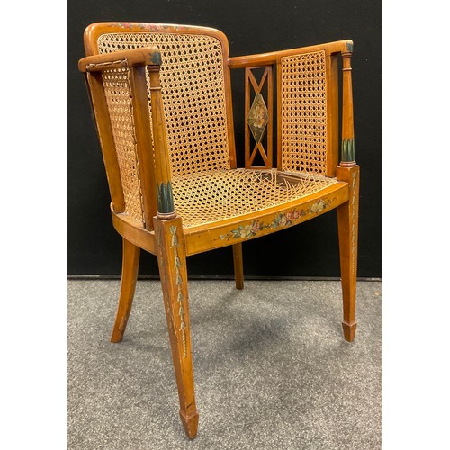 675A - An Edwardian Sheraton Revival painted satinwood armchair, Berger weave back, sides, and seat, tapere... 