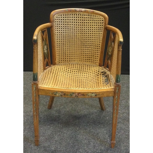 675A - An Edwardian Sheraton Revival painted satinwood armchair, Berger weave back, sides, and seat, tapere... 