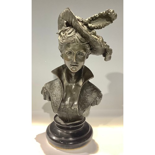 43 - A dark patinated bronze bust, lady of fashion with stylised collar and feathered hat, black marble b... 