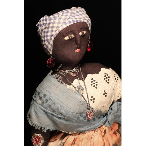 4114 - Folk Art - an early 20th century black cloth rag doll, probably produced in Bahia (Brazil), the stuf... 