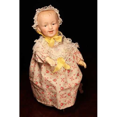 4119 - Automata - a Gebrüder Heubach (Germany) bisque head novelty walking automaton doll on wheels, the bi... 