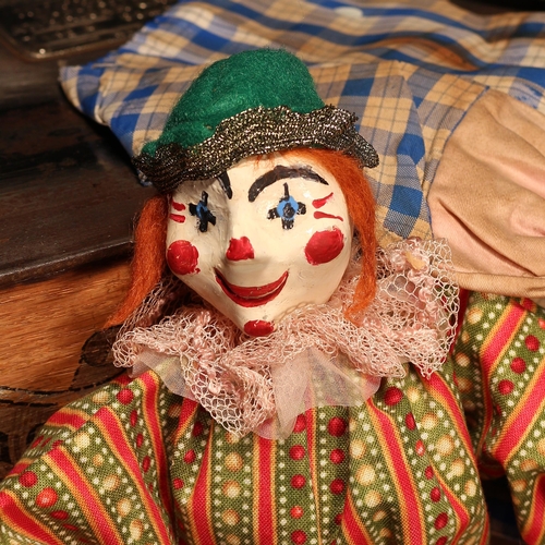 4121 - A novelty carved and painted wooden head doll, in the form of a Clown, the carved and painted wooden... 