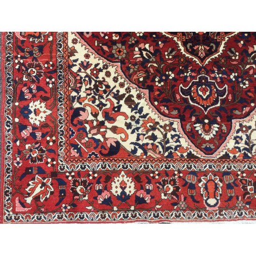 175 - A Persian Tabriz rug, knotted with a central lotus-form medallion within navette-shaped field of sty... 