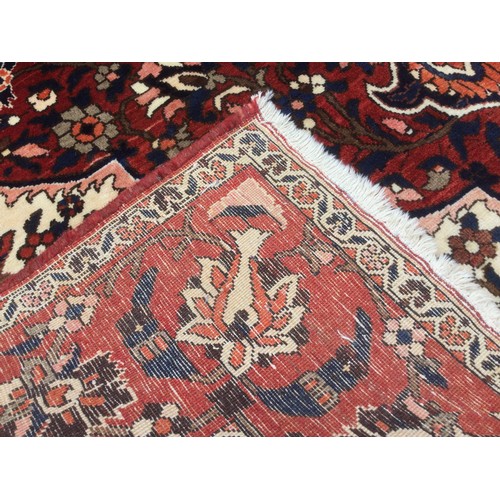 175 - A Persian Tabriz rug, knotted with a central lotus-form medallion within navette-shaped field of sty... 