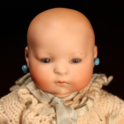 4128 - A Heubach Koppelsdorf (Germany) bisque head and painted jointed composition bodied 'Dream Baby' doll... 