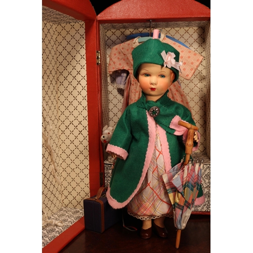 4137 - An early 20th century painted composition head and painted composition jointed bodied doll, the pain... 