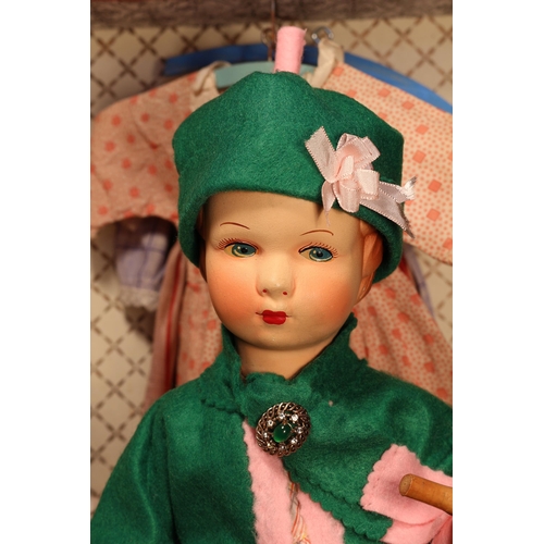 4137 - An early 20th century painted composition head and painted composition jointed bodied doll, the pain... 