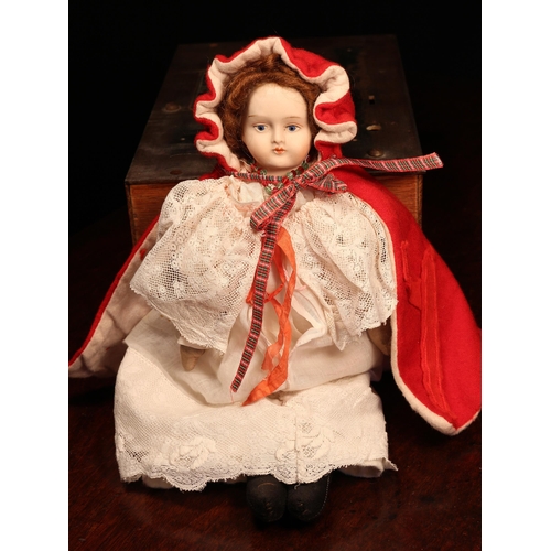 4139 - A bisque shoulder head doll, the bisque shoulder head with painted features including brown eyebrows... 