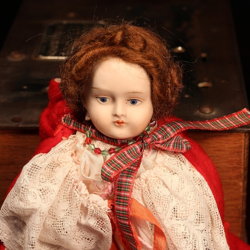 4139 - A bisque shoulder head doll, the bisque shoulder head with painted features including brown eyebrows... 