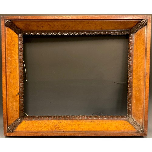 193 - A late 19th / early 20th century burr walnut deep swept picture frame, carved stiff-leaves decoratio... 