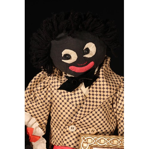 4141 - Folk Art - an early 20th century stuffed cloth black doll, the fabric head applied with black boot b... 